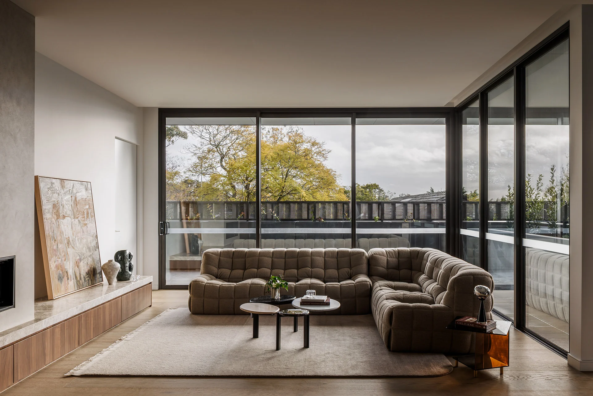 Low timber cabinetry beneath the living-room windows